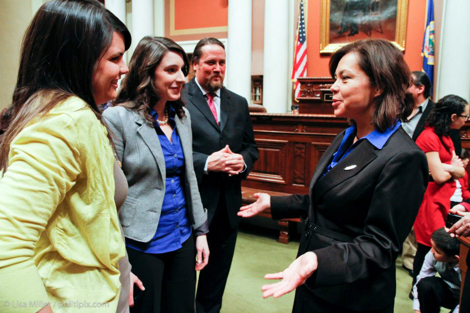 Meagan Bachmayer '08 (second from left) on the floor of the Minnesota House.