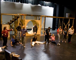 Students rehearse a scene from Urinetown during January IEX.
