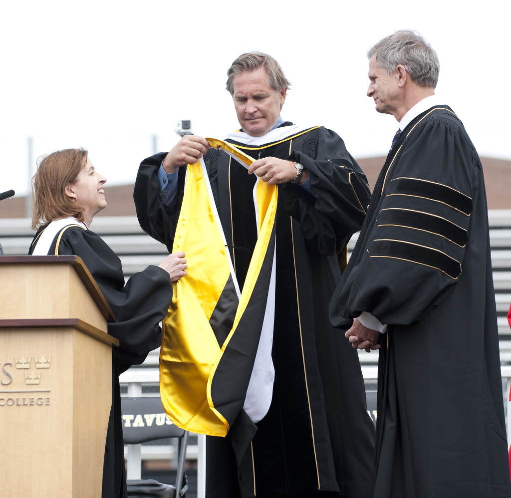Vice President Ken Westphal (far right) is congratulated by President Bergman and Board of Trustees Chair George Hicks. 