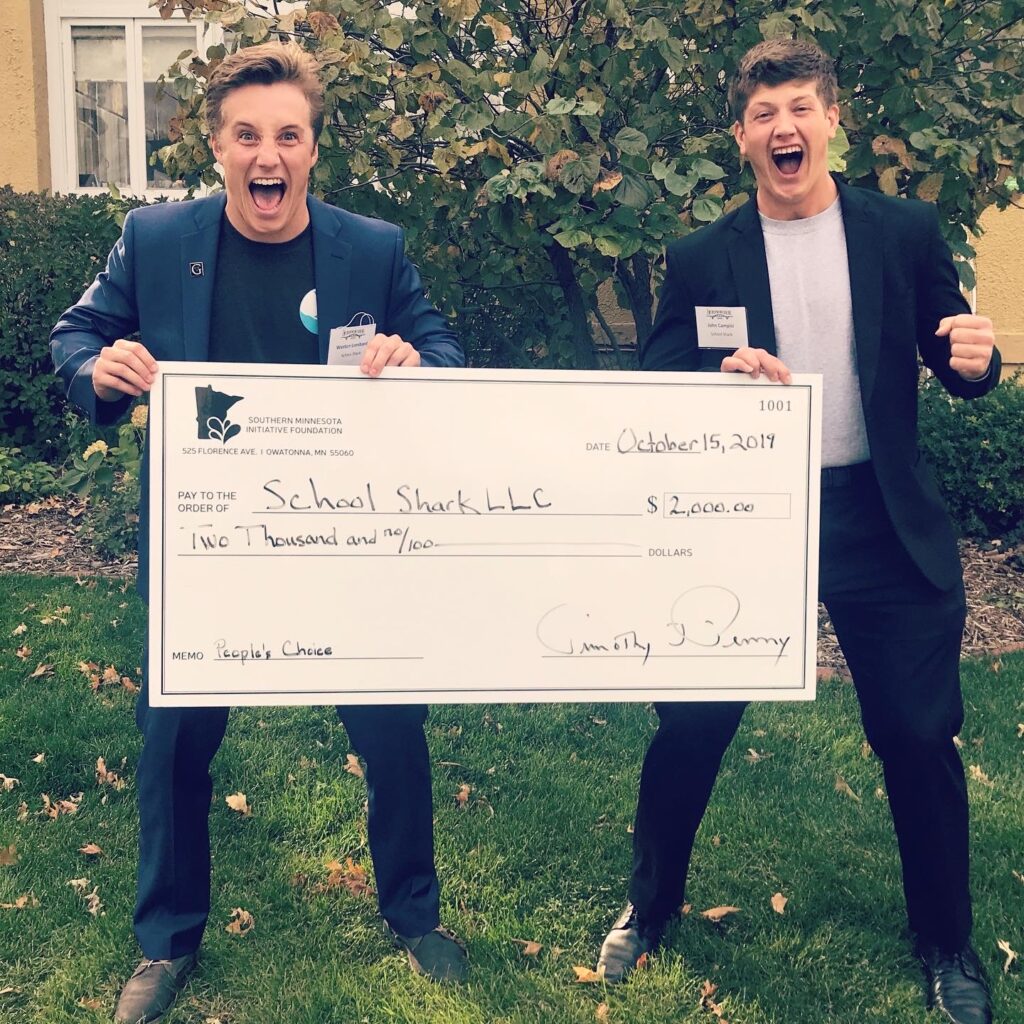Weston Lombard and John Campisi celebrate after their company, School Shark, won the People's Choice Award.
